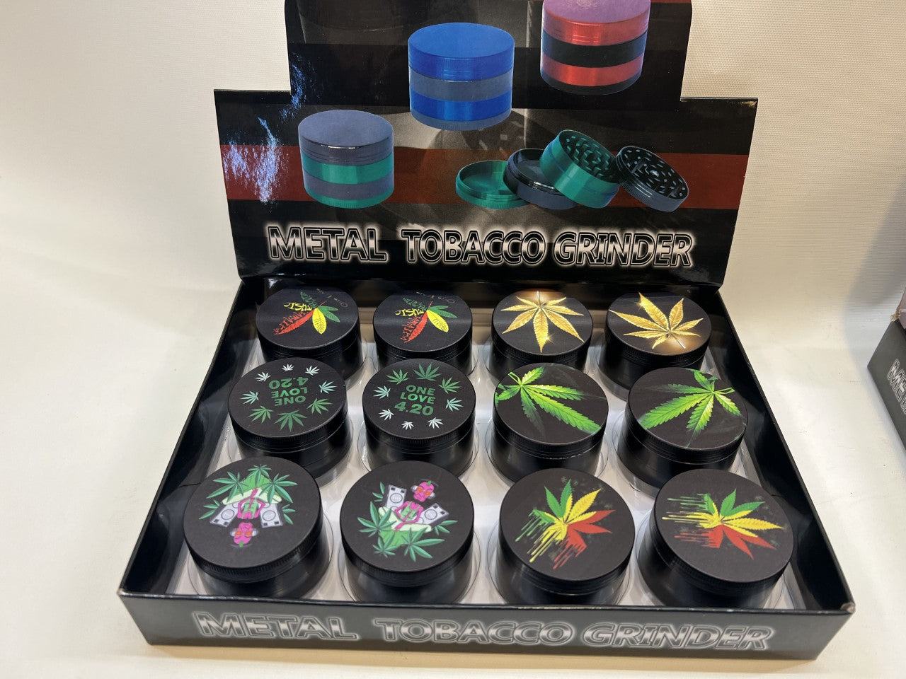 50MM MIX DESIGNS METAL GRINDER BOX OF 12CT