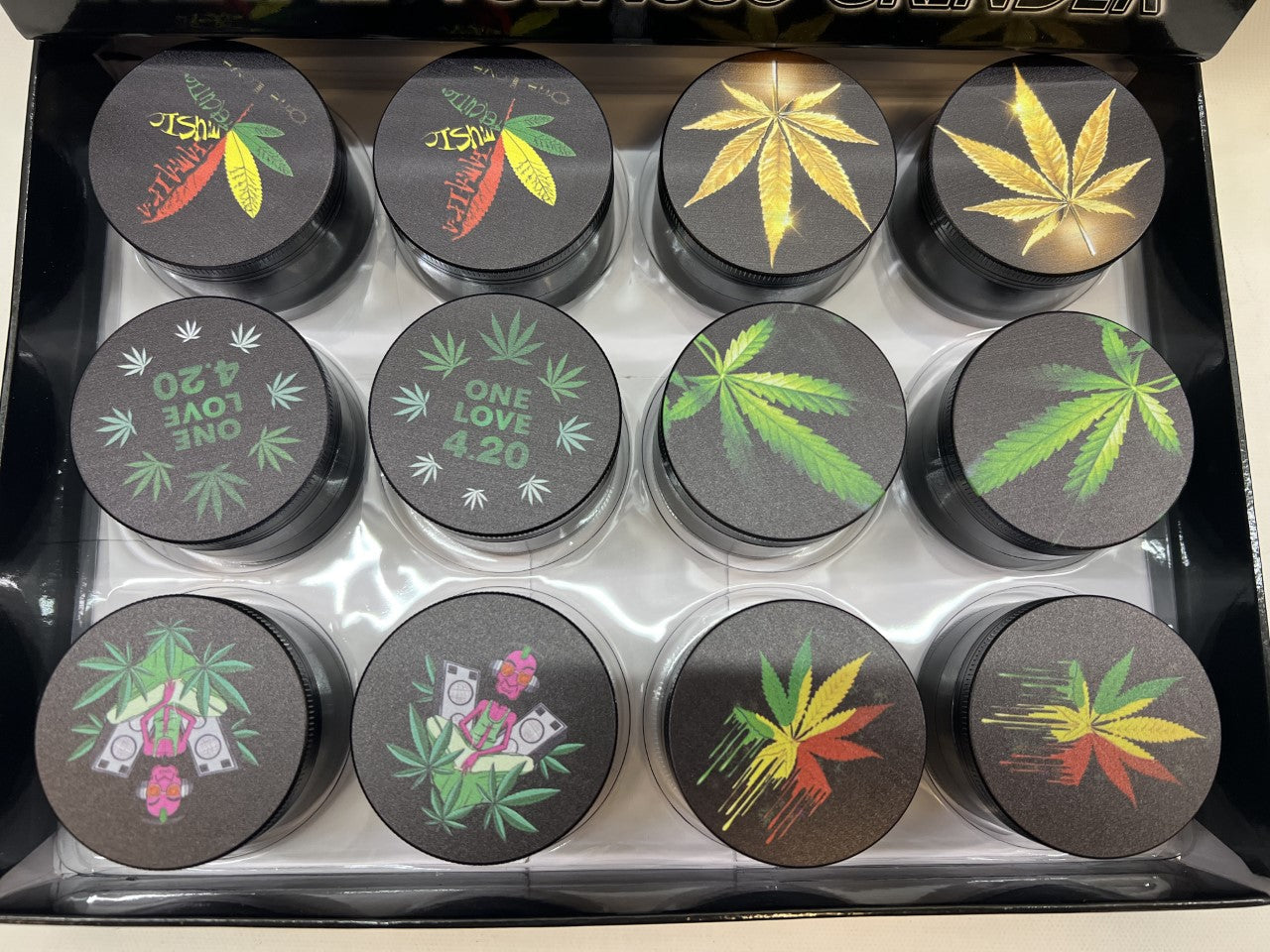 50MM MIX DESIGNS METAL GRINDER BOX OF 12CT